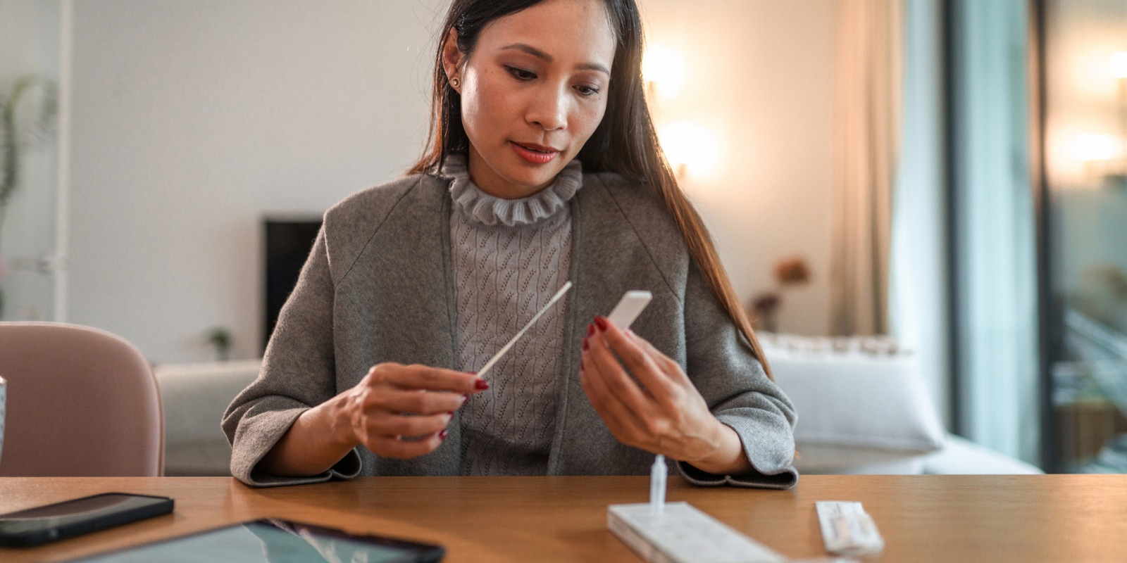 Woman taking an at-home COVID-19 test